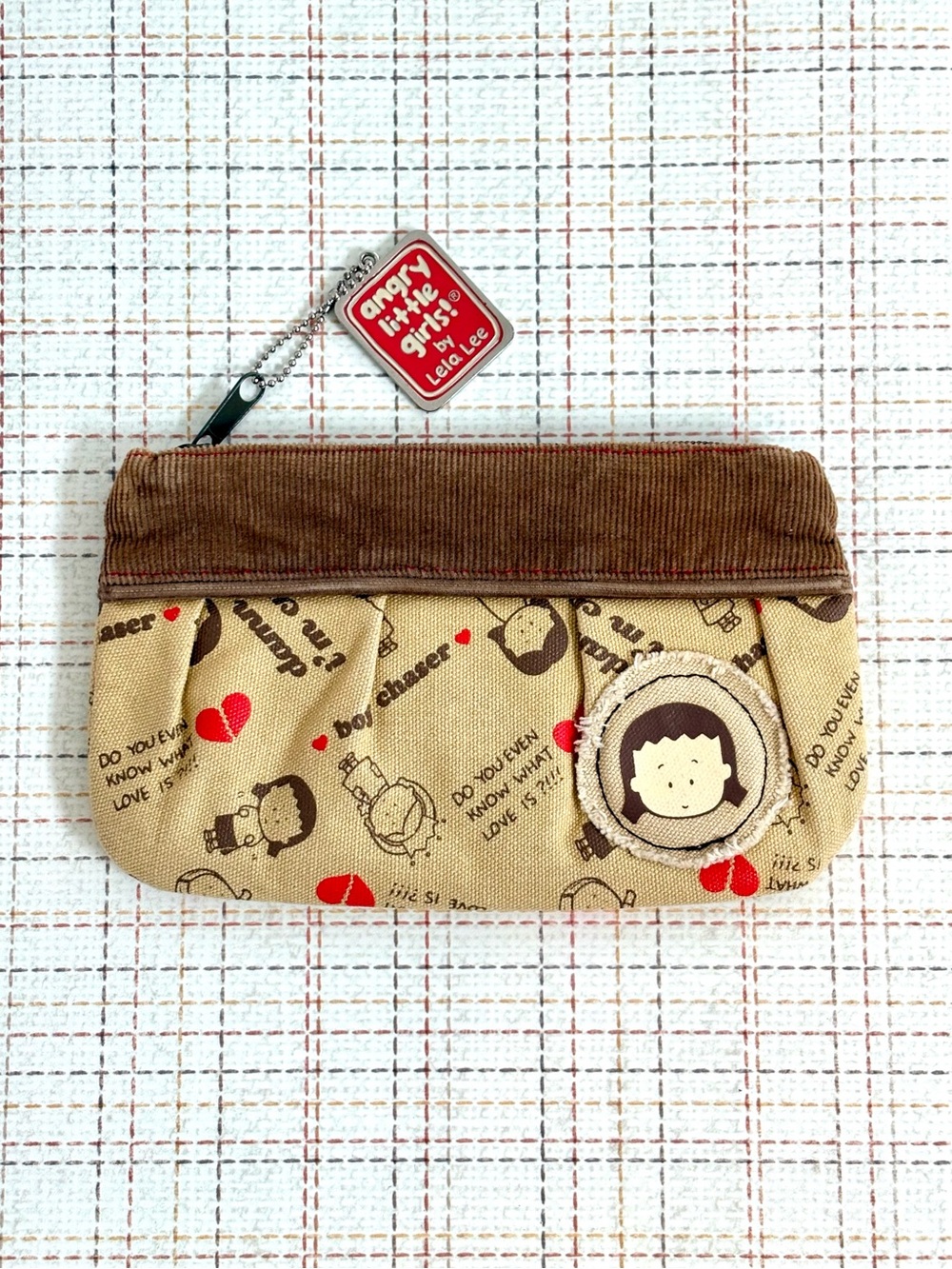 Beige & Brown 'Angry Little Girls' Zip Cosmetic Pouch by Lela Lee